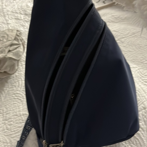 Sakroots backpack. Navy EcoTwill fabric. 9” L x 6” W x 15” H. 28.5” drop. - Picture 4 of 5